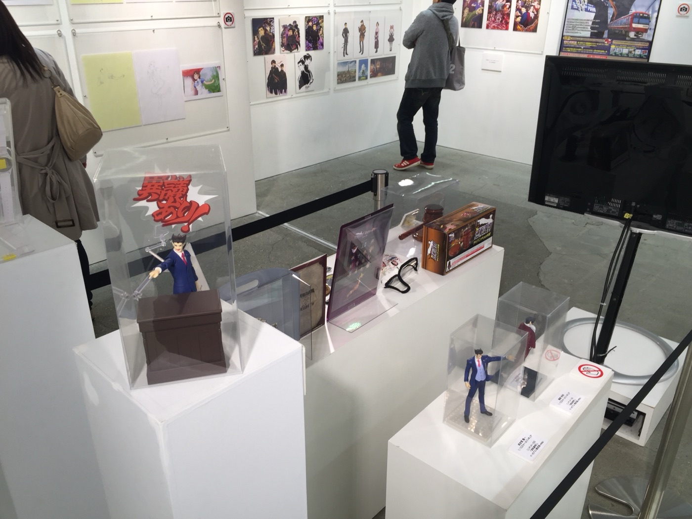 Ace Attorney figures and merchandise displayed in the middle of the room